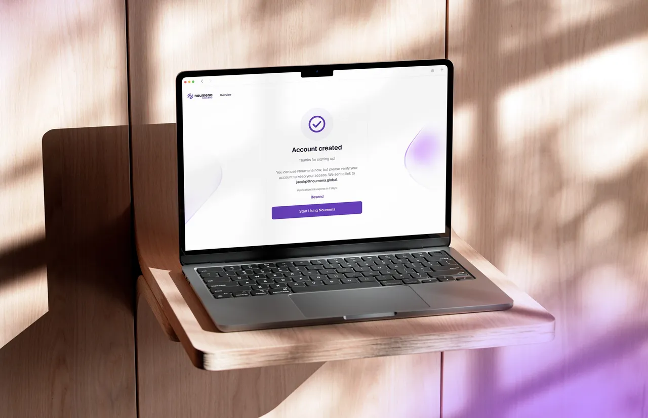 Laptop on a wooden shelf showing the account created confirmation screen